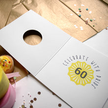 Load image into Gallery viewer, Card with &#39;Celebrate with Pride! 60&#39; design on a table with confetti and a cupcake.