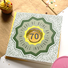 Load image into Gallery viewer, 70th birthday card with decorative elements on a table