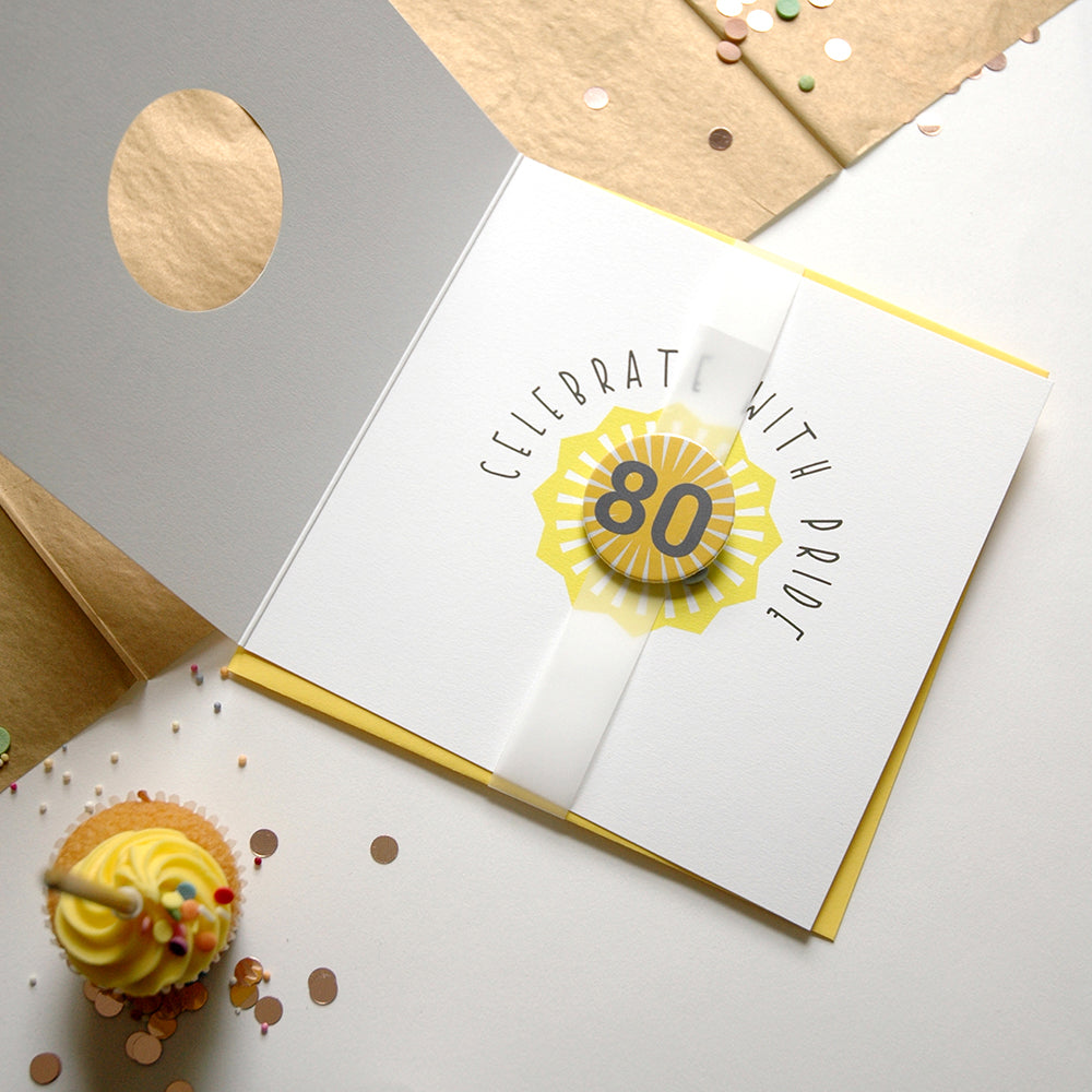80th birthday card with a cupcake and confetti on a light gray background