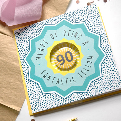 Greeting card with '90 years of being a fantastic fellow' text on a polka dot background