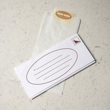 Load image into Gallery viewer, Bread bag and address insert on a marble surface.