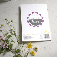 Load image into Gallery viewer, Card with branding on a gray surface with flowers