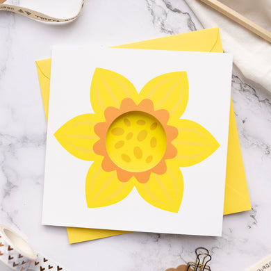 Card with sunflower design on a marble surface