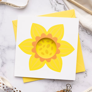 Card with sunflower design on a marble surface