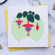 Load image into Gallery viewer, Card with fuchsia plant design on a marble surface