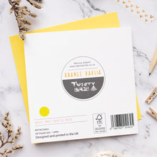 Load image into Gallery viewer, Back of greetings card with a barcode on a marble surface