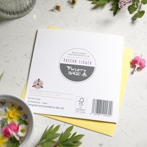 Back of Greetings card with a passion flower on the front. The card has a circle cut out on the front. this pictures the barcode and FSC logo.