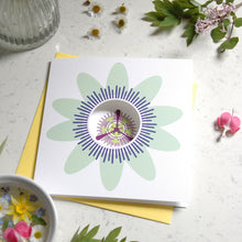 Load image into Gallery viewer, Greetings card with a passion flower on the front. The card has a circle cut out on the front.