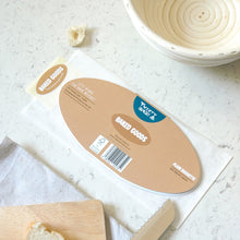 Load image into Gallery viewer, Bak of a bagette shaped greetings card on a light surface
