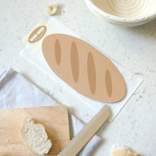 Load image into Gallery viewer, A bagette shaped greetings card on a marble surface
