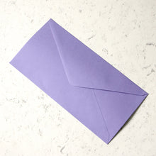 Load image into Gallery viewer, Purple envelope on a marble surface.
