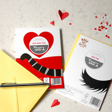 Load image into Gallery viewer, Two novelty nose to toes cat and dog greeting cards with red and yellow envelopes, a yellow card, and a black pen on a light marble surface with scattered red hearts.