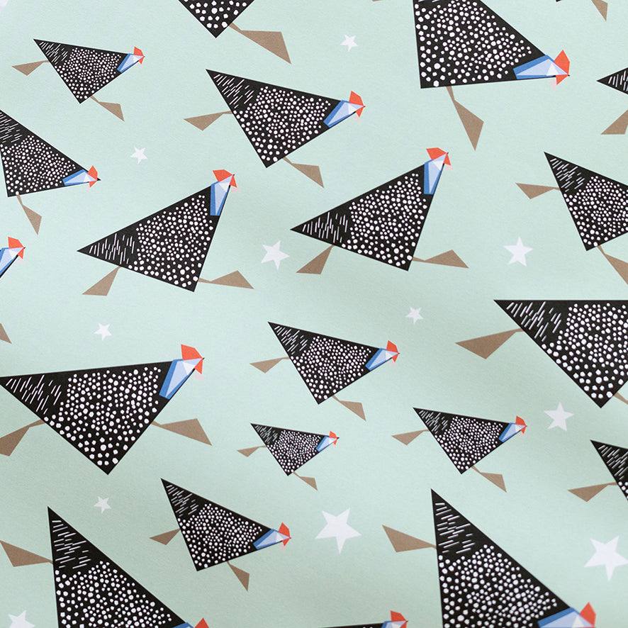 Pattern of guineafowl with black geometric shapes with white dots on a light green background
