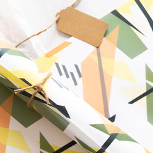 Load image into Gallery viewer, Geometric patterned paper with a brown tag on a white background