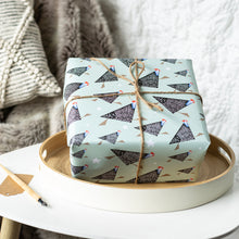 Load image into Gallery viewer, Gift wrapped in paper with bird pattern on a wooden tray