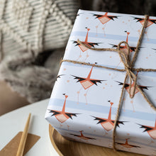Load image into Gallery viewer, Gift wrapped in paper with bird pattern on a wooden table